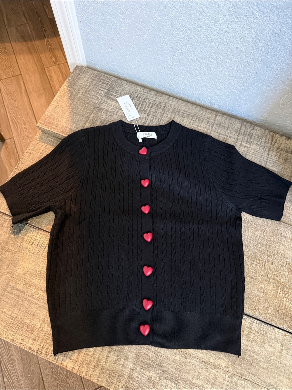Black Short-Sleeve Cable-Knit Sweater with Red Heart Buttons